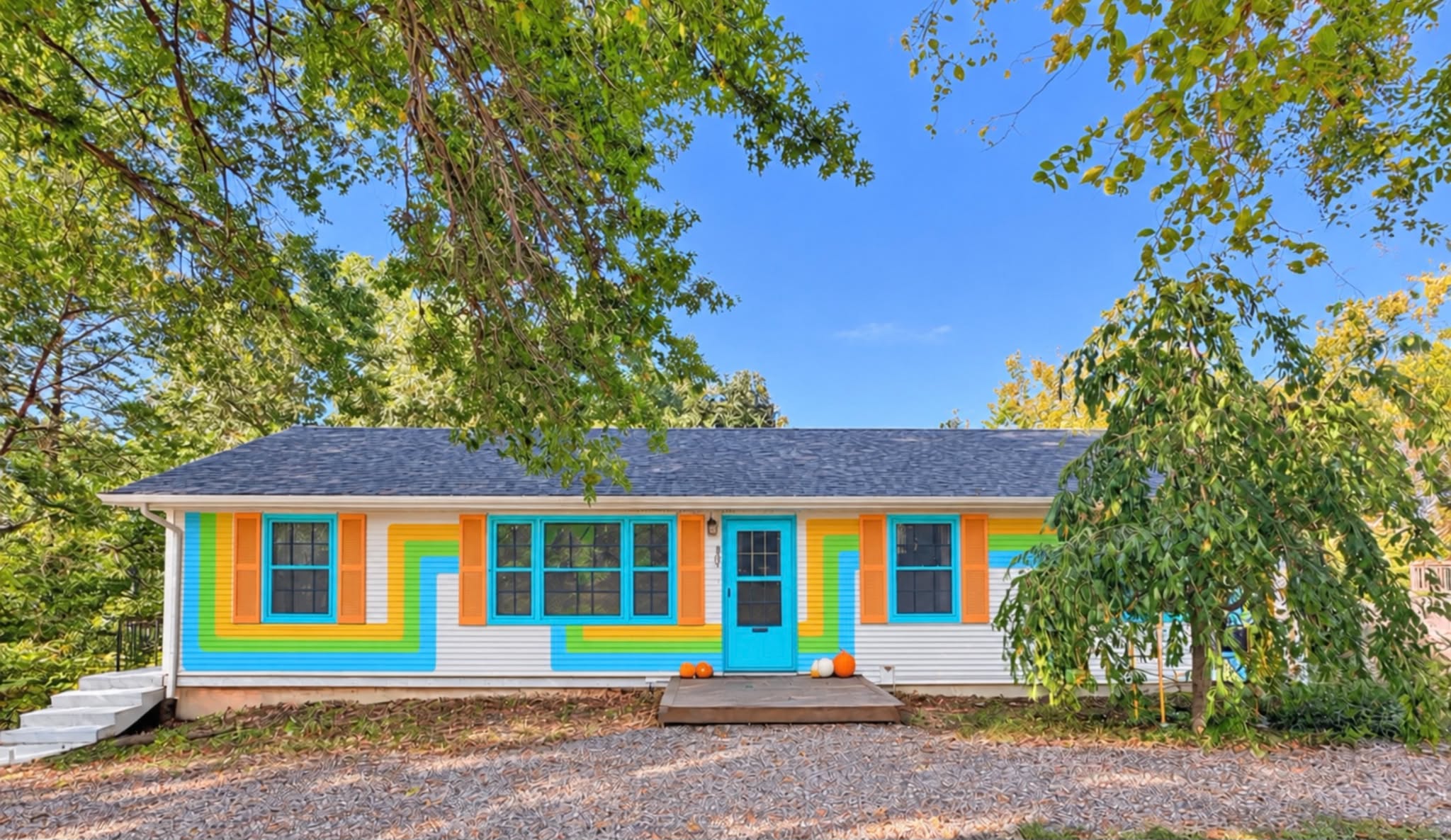 Head on view of the mural on vinyl siding and shutters.